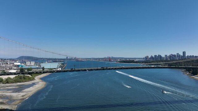Drone Horizontal Dolly Across Lions Gate Bridge with Downtown Vancouver Skyline, British Columbia Canada
