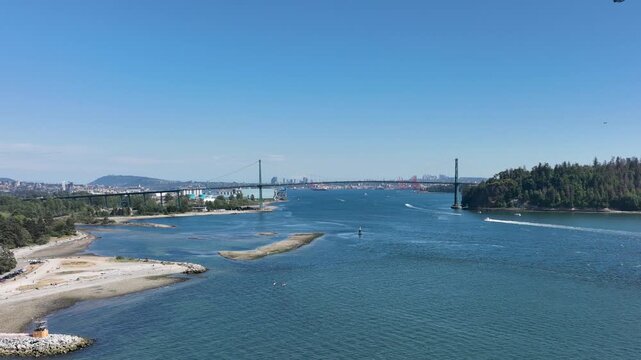 Floatplane Flying Over Burrard Inlet with Lions Gate Bridge and Vancouver Skyline, British Columbia Canada