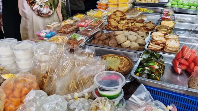 Pan up of local Malay savory 'kueh muih' sold at local market in the Ramadhan month in Kelantan, Malaysia.Local savory normally tasted sweet and not good for diabetic. 