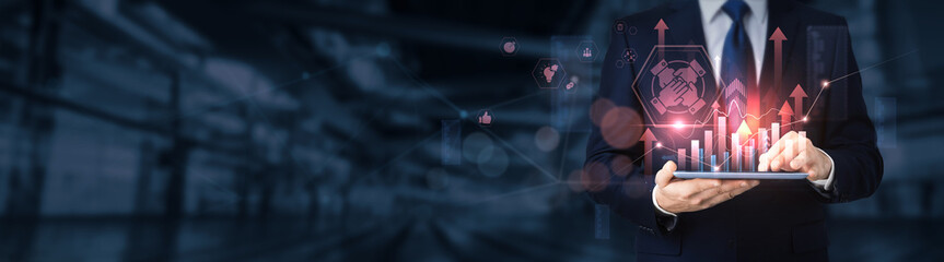 Businessman using a tablet for analyzing teamwork data and information, collaboration strategy,...