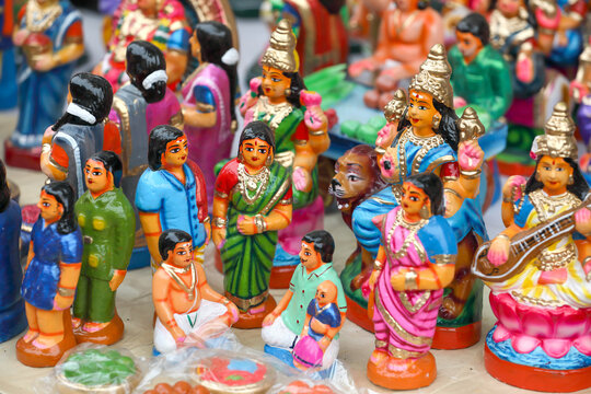 Traditional Hindu ear-piercing ceremony idols are displayed for sale in a shop for the golu festival