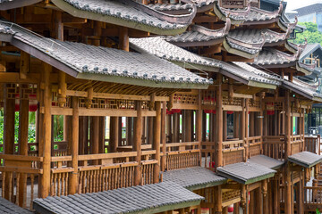 Ancient ethnic architecture of Fengyu Bridge at Folk Song Lake in Nanning, Guangxi, China © Steve
