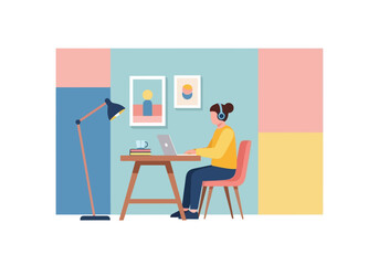 Fototapeta premium Modern Home Office Setup With Woman Working Remotely On Laptop Wearing Headphones And Using Desk Lamp For Illumination