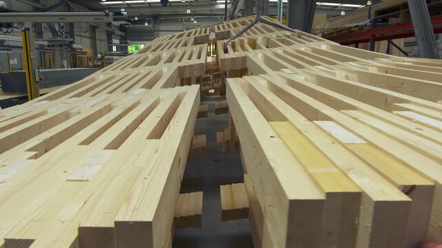 Mass timber construction beams stacked in a factory for building assembly