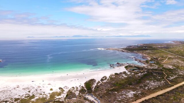 High aerial arc over scenic white sand Moonlight Beach at Pringle Bay Hangklip