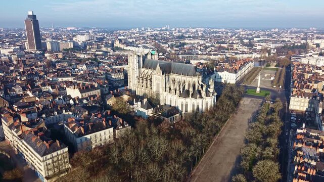 Nantes cityscape, featuring Cathedral of St Peter and St Paul, Place Mar&eacute;chal Foch, and Tour de Bretagne in Nantes, France. Aerial forward