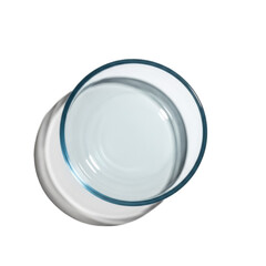 Macro flat lay of an empty, circular, crystal-clear glass serving bowl with a cerulean tint on a bright white infinity background, concept of high-end clarity and minimalism