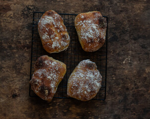 Fototapeta premium Homemade ciabatta bread on a wooden background, top view