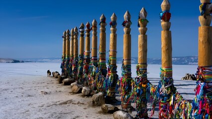 Thirteen Shamanic Serge Ritual Poles with Colorful Ribbons on Cape Burkhan, Olkhon Island, Frozen Lake Baikal, Russia.  © Brandano007