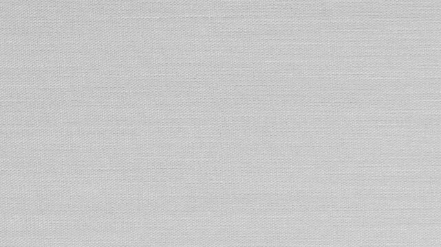 White Canvas Texture Background.Blank, light gray woven fabric texture. Perfect for minimalist designs and text overlays.