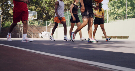 Group, legs and people prepare on basketball court for competitive, collaboration or support. Training game, teamwork or outdoor athletes for solidarity, fitness or workout in match or challenge