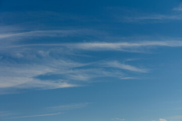 Fototapeta premium Whispers of the sky dance above a serene landscape at twilight, inviting