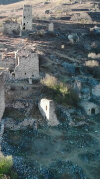 Ancient stone towers of a ruined mountain village. Media