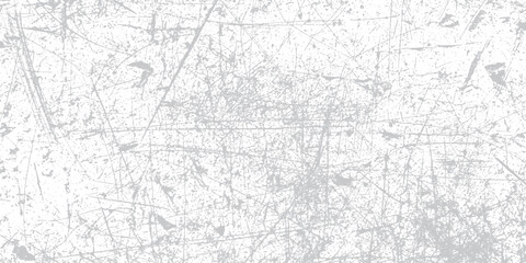 Obraz premium Scratched and distressed white background with intricate grey lines and speckles, gritty texture for grunge or vintage design overlays.