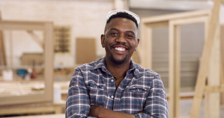 Portrait, carpenter and black man in warehouse, arms crossed and manufacturing project. Small...