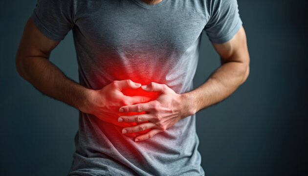 Man holds abdomen with sharp pain. Red glow shows digestive issue, stomach ache, or inflammation. Urgent health problem needs fast diagnosis and care.