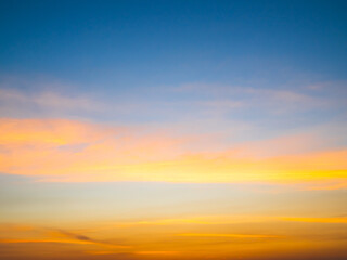Fototapeta premium Sky sunset evening sunrise cloud weather dramatic landscape goldent and indigo color gradient pastel horizon, twilight yellow golden reflection morning nature environment energy ecosystem change