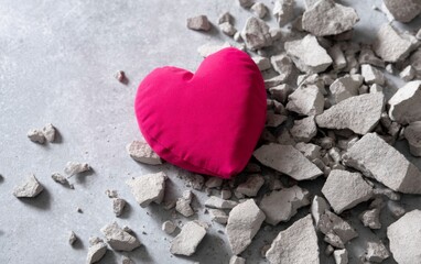 Obraz premium Pink Heart Breaking Through Cracked Limestone Surface
