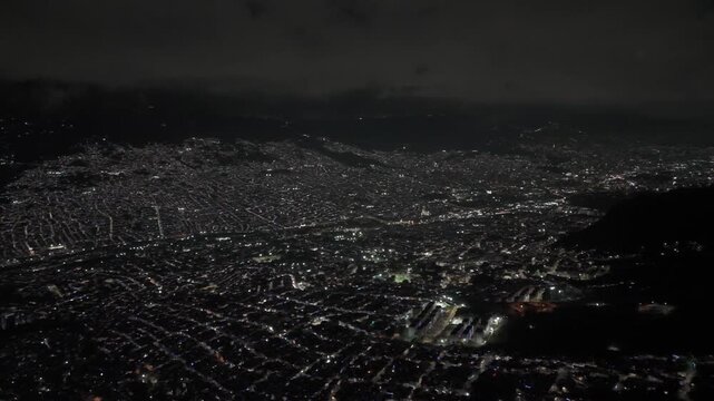 Cinematic aerial views of Medellin, Colombia captured from a scenic viewpoint overlooking the city. The footage showcases the urban landscape surrounded by green mountains in the Aburr&aacute; Valley, highli