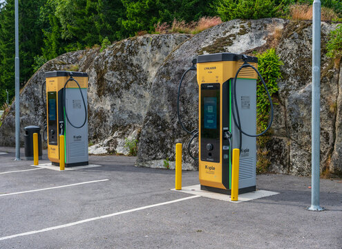 Bamble, Norway - July 14 2025: Electric car charging station in rocky landscape.