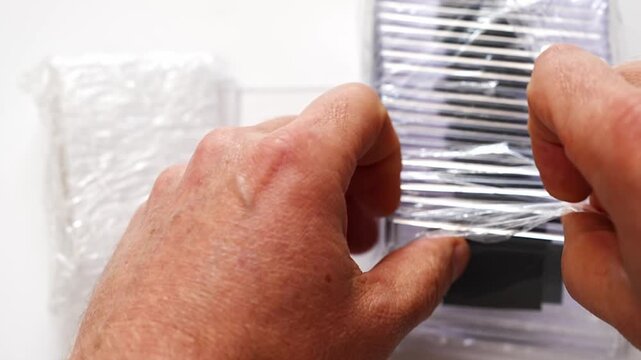 removing plastic blanks for photo magnets from packaging