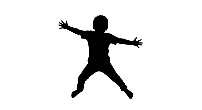 Silhouette of a jumping little boy.