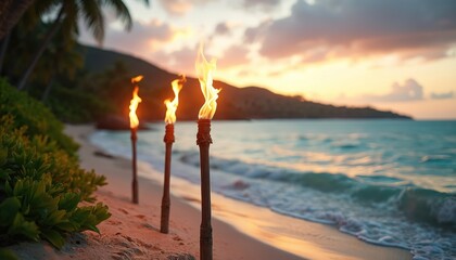 Fototapeta premium Three tiki torches burn on sand beach near ocean waves at sunset. Palm trees and island hills outline horizon. Warm glow lights tropical evening paradise scene.
