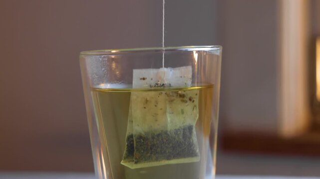 Video of teabag in glass.