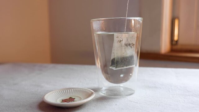 Video of teabag in a glass cup.