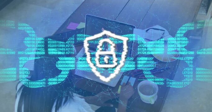 After pause woman at table using laptop, overlay code forming shield padlock for security