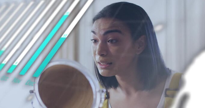 Woman checking mirror, applying makeup sponge to chin for coverage, animated charts overlaying face