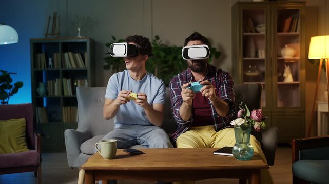 Teen boy and his dad in VR headsets play video game, virtual reality experience