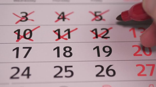 Calendar Hand Crossing Out Days On Calendar In CloseUp Countdown, Habitual Tracker Marking Red X Across Dates, Daily Routine And Progress Toward Deadline, Sense Of Completion And Relief