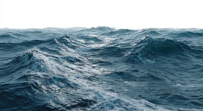 Dynamic, open ocean view with waves cresting and rolling towards a bright horizon