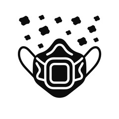 Obraz premium A black and white image of a face mask with particles