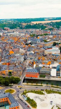 Vertical video. Namur, Belgium. Arrow at the confluence of the Sambre and Meuse rivers. City Square d Armes. Drone footage. Rich colors