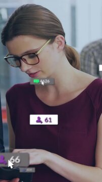 Vertical video: Woman tapping tablet martech UI overlays rising while peer pointing tracking growth