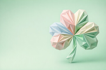 3D Low-Poly Paper Sculpture of a Pastel Shamrock. Minimalist St. Patrick's Day Origami Clover on Mint Background.