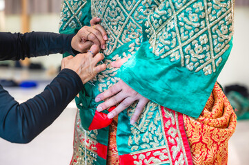 Khon costume doing process of dressing Khon performer by sewn onto the performer's body to ensure a perfect, skin-tight fit that stays secure during high-energy acrobatics perform