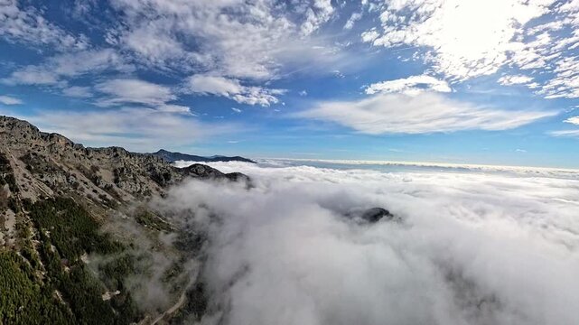 Aerial view above sea of clouds covering mountain valleys in the French Riviera hinterland