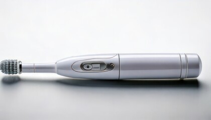 Close-up of a white electric toothbrush on a reflective surface, dental hygiene concept.