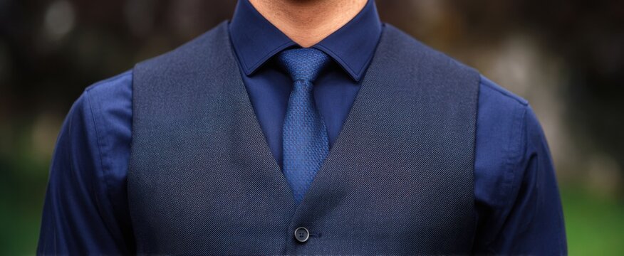 Classic navy blue vest featuring button details ideal for formal wear.