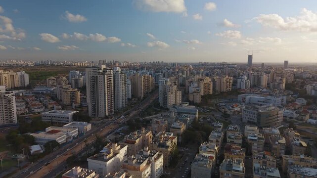 Holon Kiryat Rabin and Vatikim neighborhoods during a push in shot showing the Social Security building, Israel.