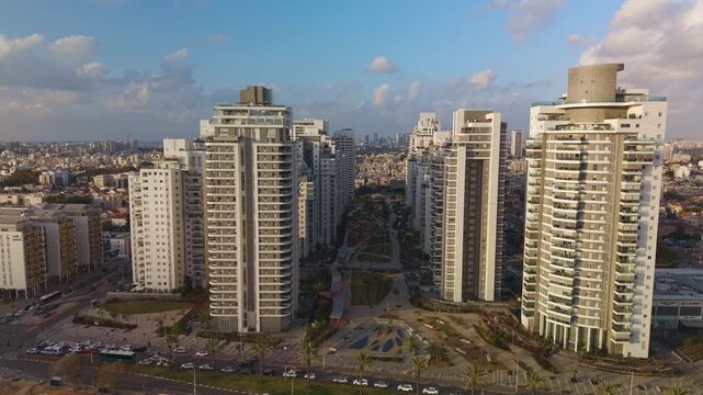 Holon Kiryat Ayalon neighborhood and the towers in the avenue park captured during a rising drone shot, Israel.