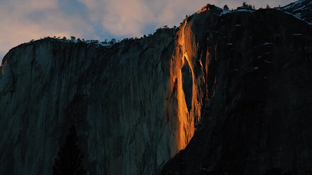 Medium shot of Firefall in Yosemite National Park as it reaches apex.