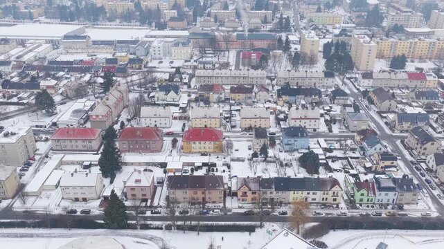 Aerial winter view of Svitavy with snow-covered homes.
Drone shot of quiet neighborhood and family houses.