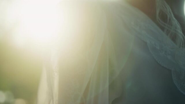 Soft Lighting Enhances Wedding Portrait. Romantic Outdoor Environment Featuring Lace And Sunlight Effects