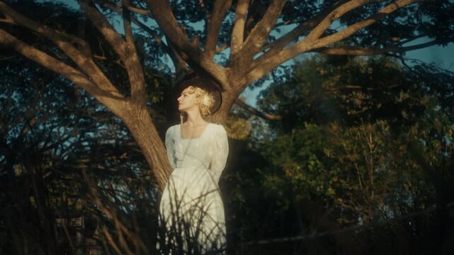 Peaceful Woman In Nature Setting. Tranquil Woman Dressed Flowing In Rural Shaded Woodland Scenery