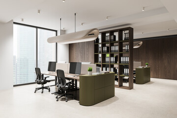 Obraz premium Modern open plan office interior with contemporary furniture, shelving units, large windows and minimalistic design elements.