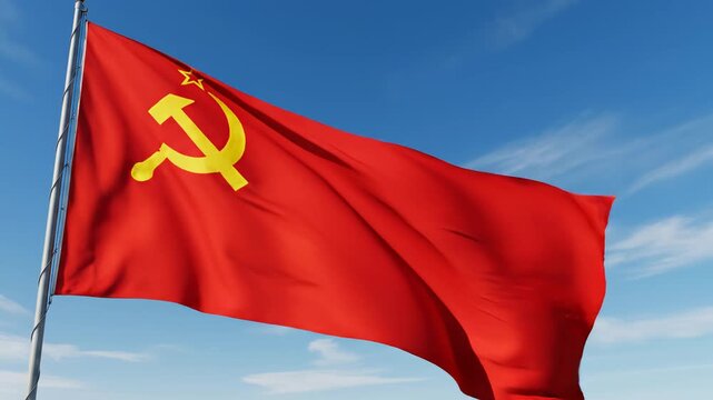 Red flag with hammer and sickle waving in sky